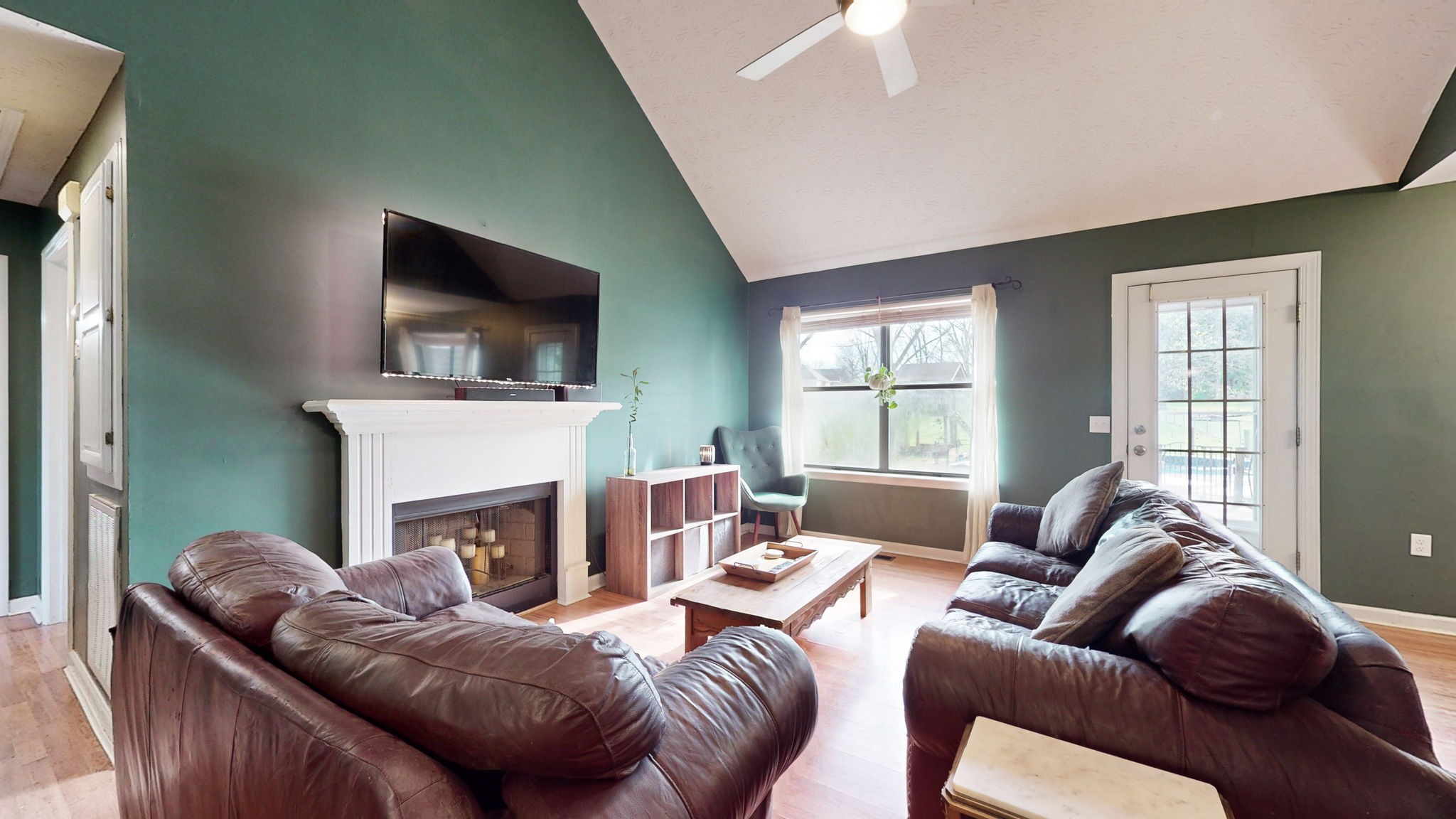 3558 Raymond Head Road Springfield, TN 37172 - Photo 8 of 50 a living room with furniture a fireplace and a flat screen tv