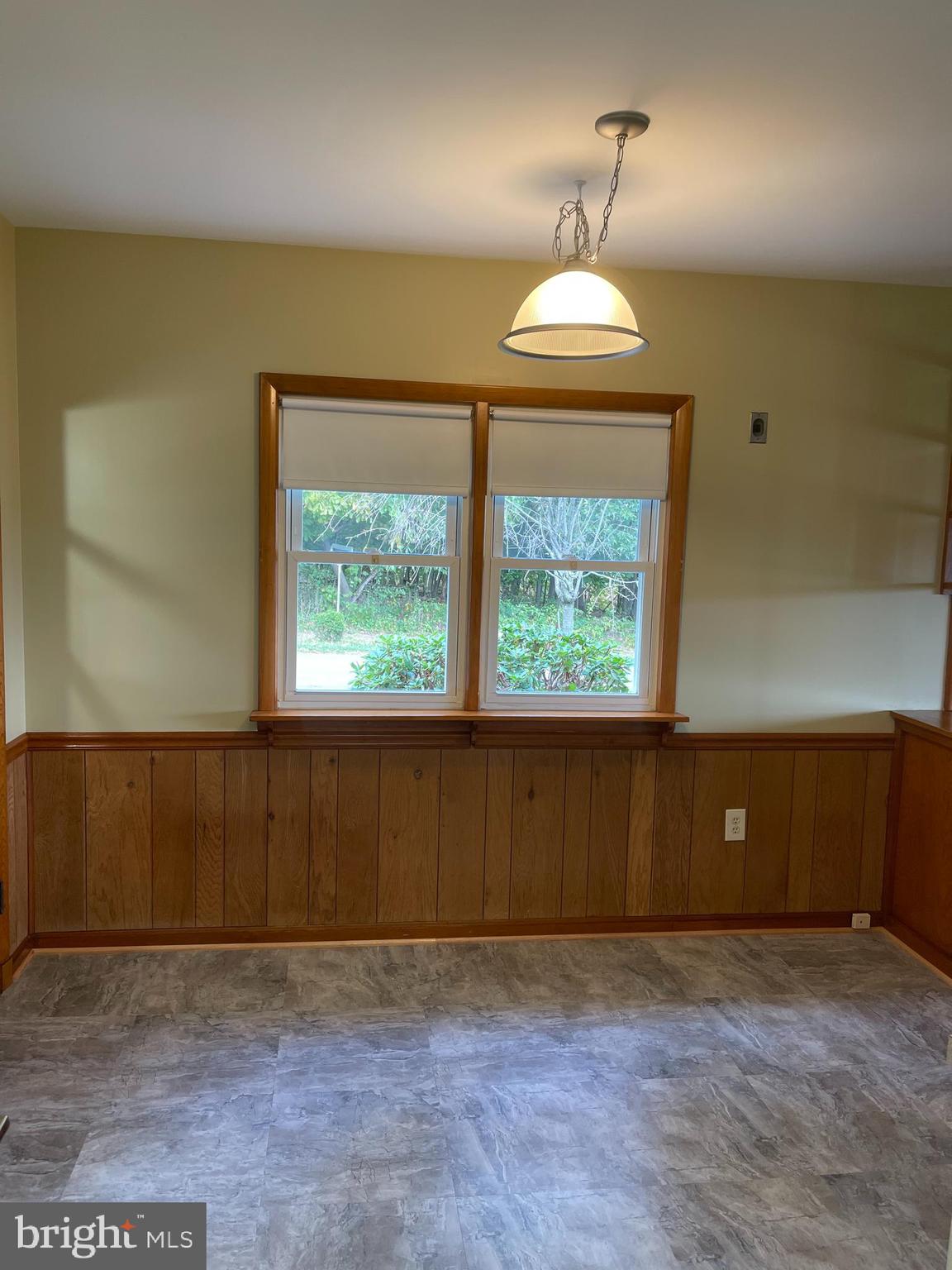 1670 Florence Road Mount Airy, MD 21771 - Photo 15 of 20 an empty room with wooden floor and windows