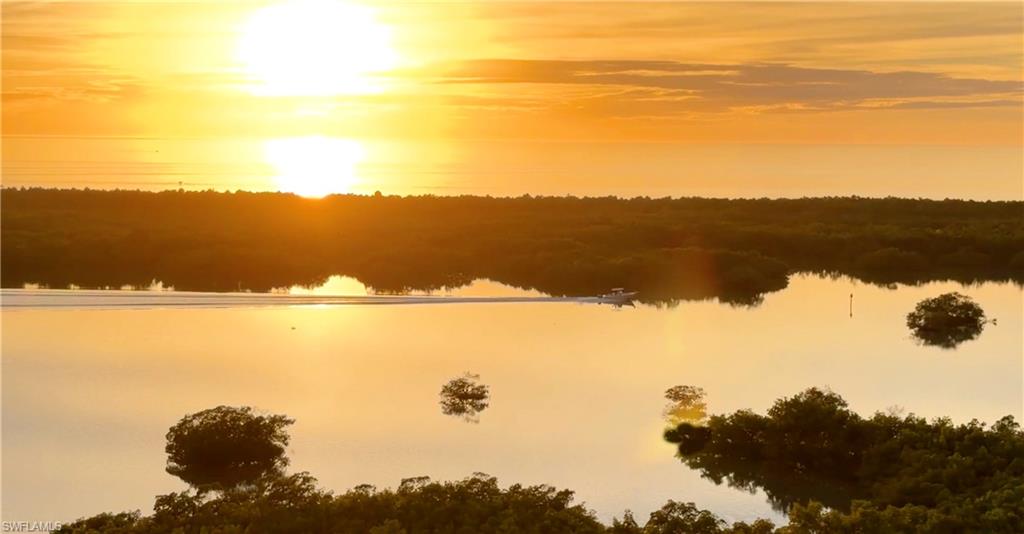 13955 Old Coast Road, Unit 1204 Naples, FL 34110 - Photo 2 of 7 a view of lake with mountain