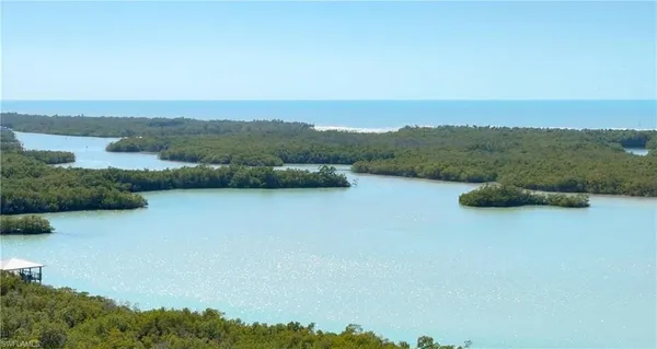 an aerial view of lake and mountain view