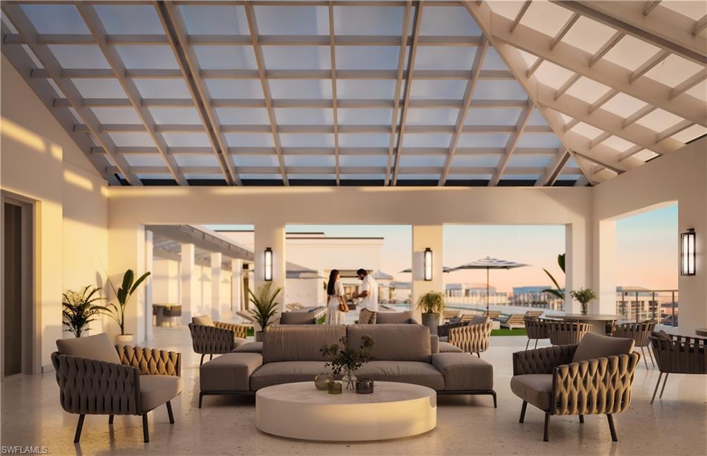 13955 Old Coast Road, Unit 1204 Naples, FL 34110 - Photo 5 of 7 a living room with furniture and a large window