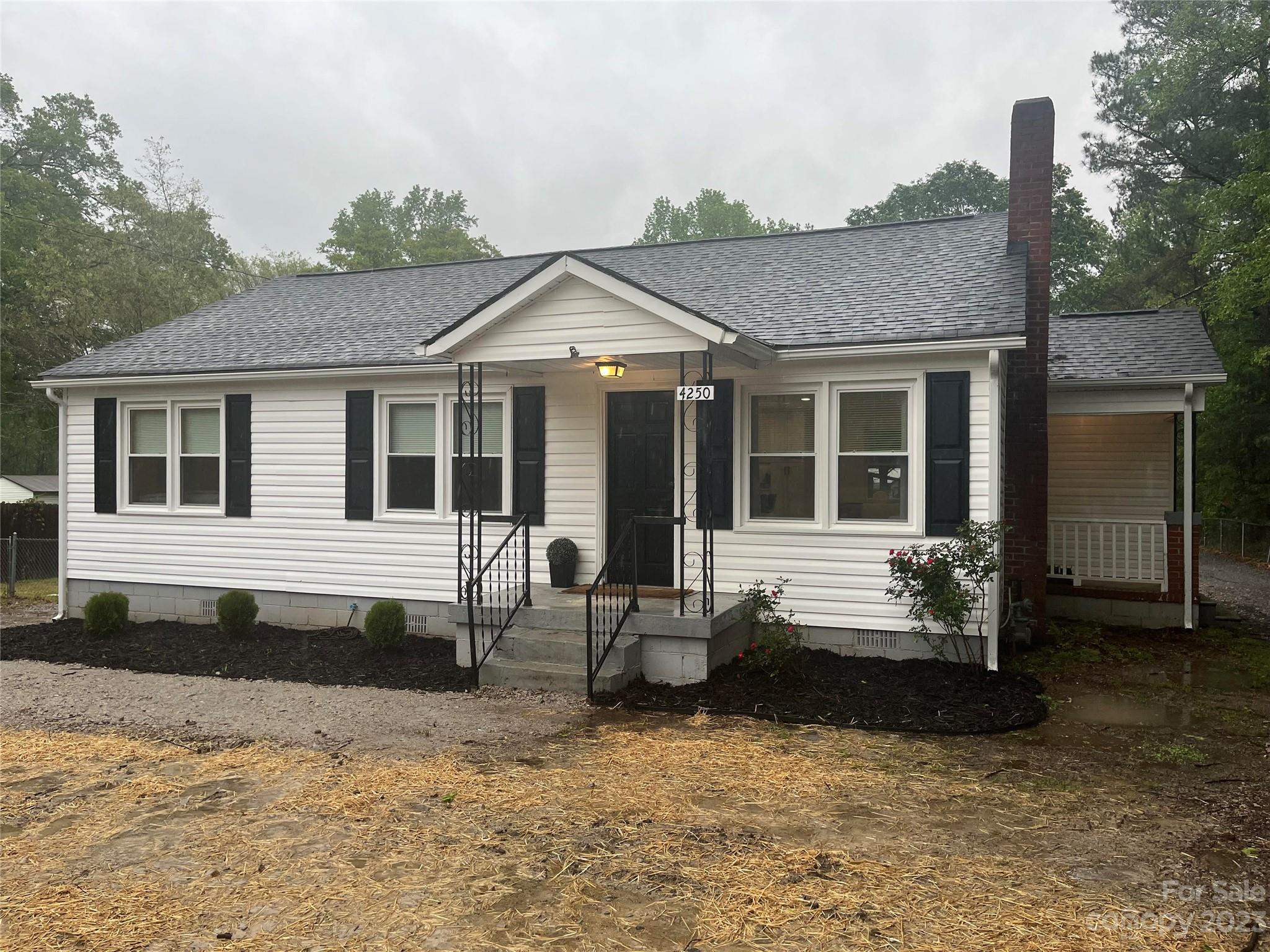 4250 Edgeland Road Edgemoor, SC 29712 - Photo 1 of 8 a front view of a house with a yard outdoor seating and barbeque oven