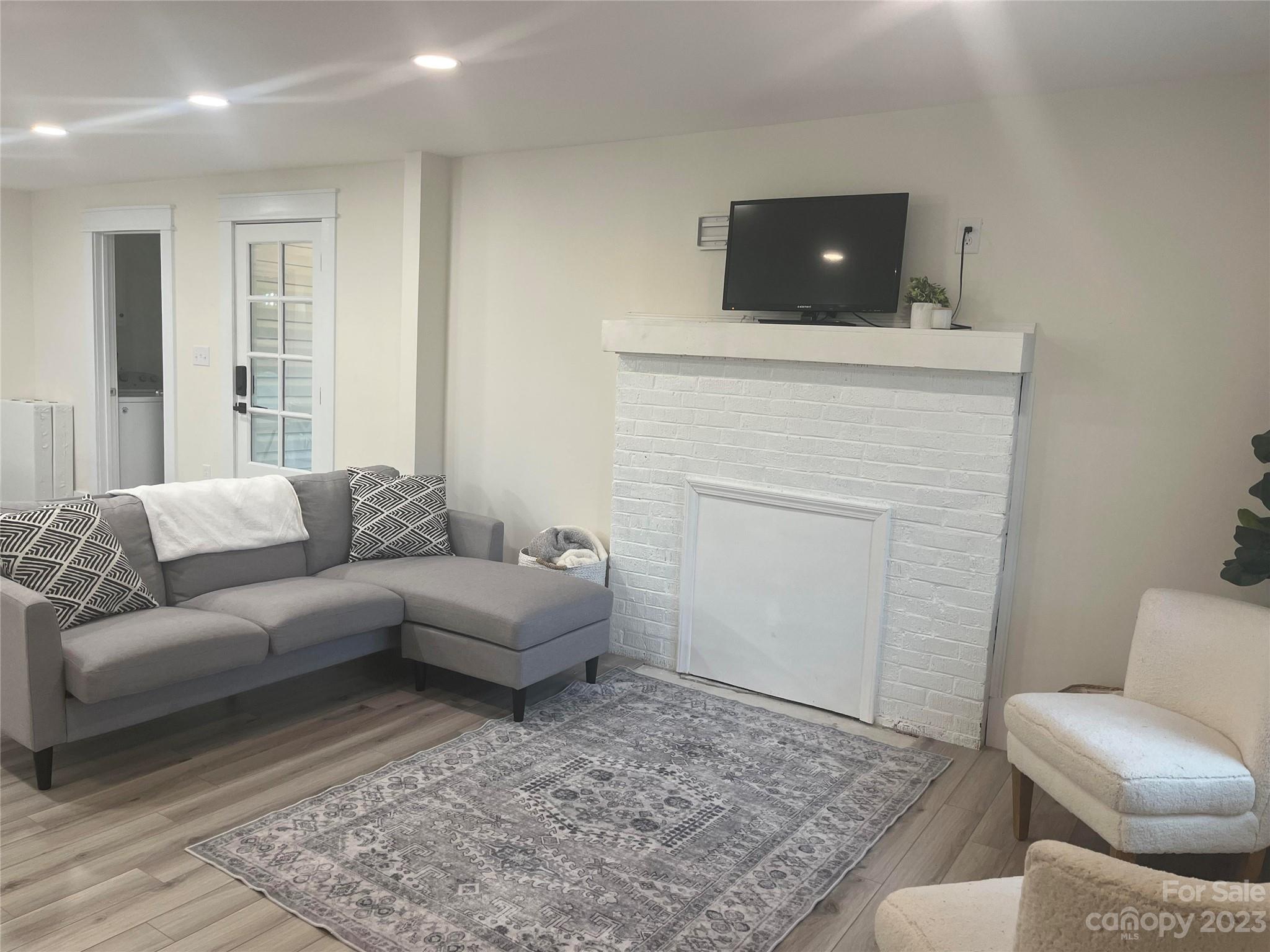 4250 Edgeland Road Edgemoor, SC 29712 - Photo 3 of 8 a living room with furniture and a flat screen tv