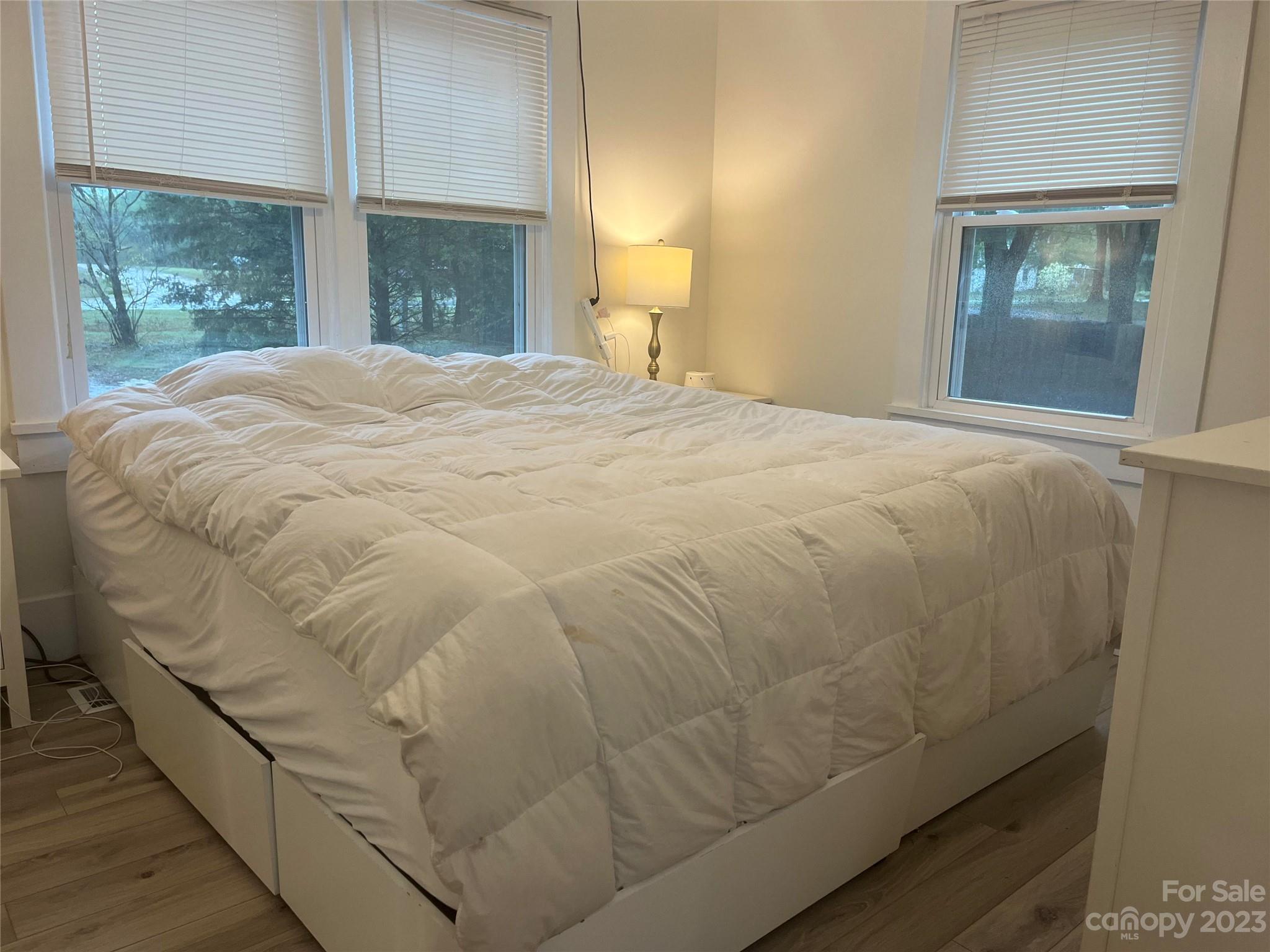 4250 Edgeland Road Edgemoor, SC 29712 - Photo 8 of 8 a large white bed in a bedroom next to a window