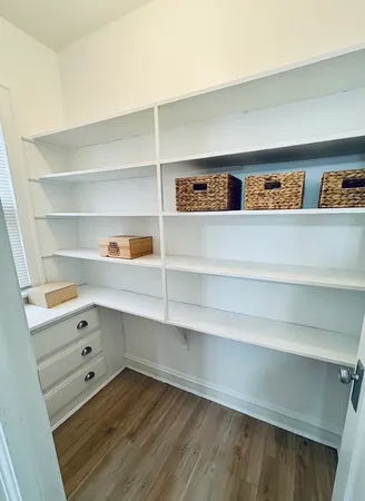 a living room with shelves