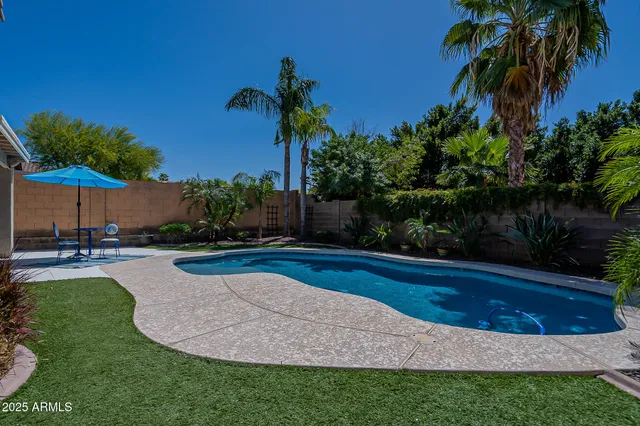 a view of swimming pool having outdoor seating