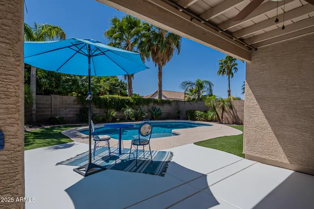 a view of a backyard with sitting area