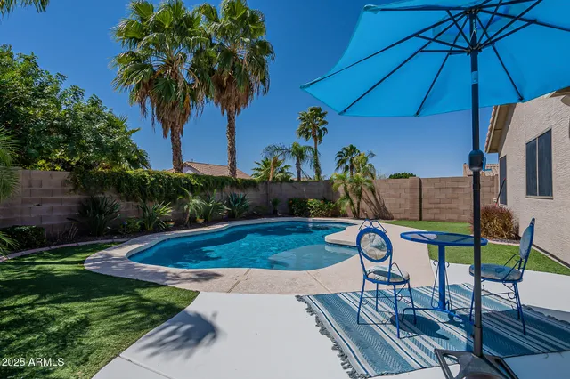 a view of yard with patio