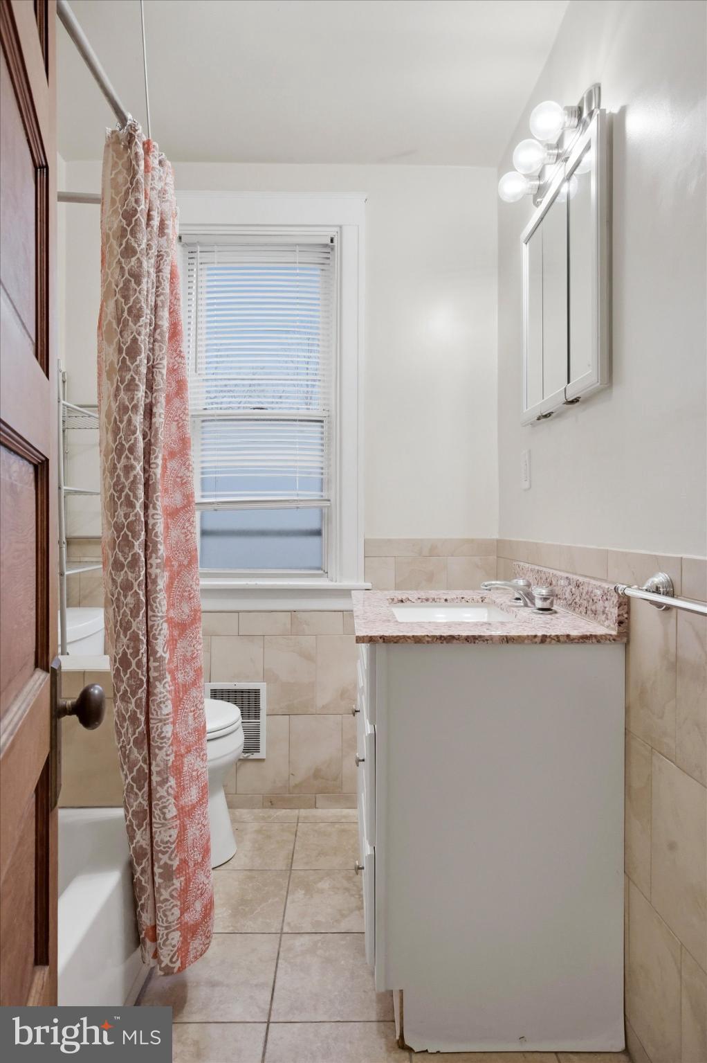 7 Rhodes Avenue Collingdale, PA 19023 - Photo 14 of 27 a bathroom with a sink a toilet and mirror