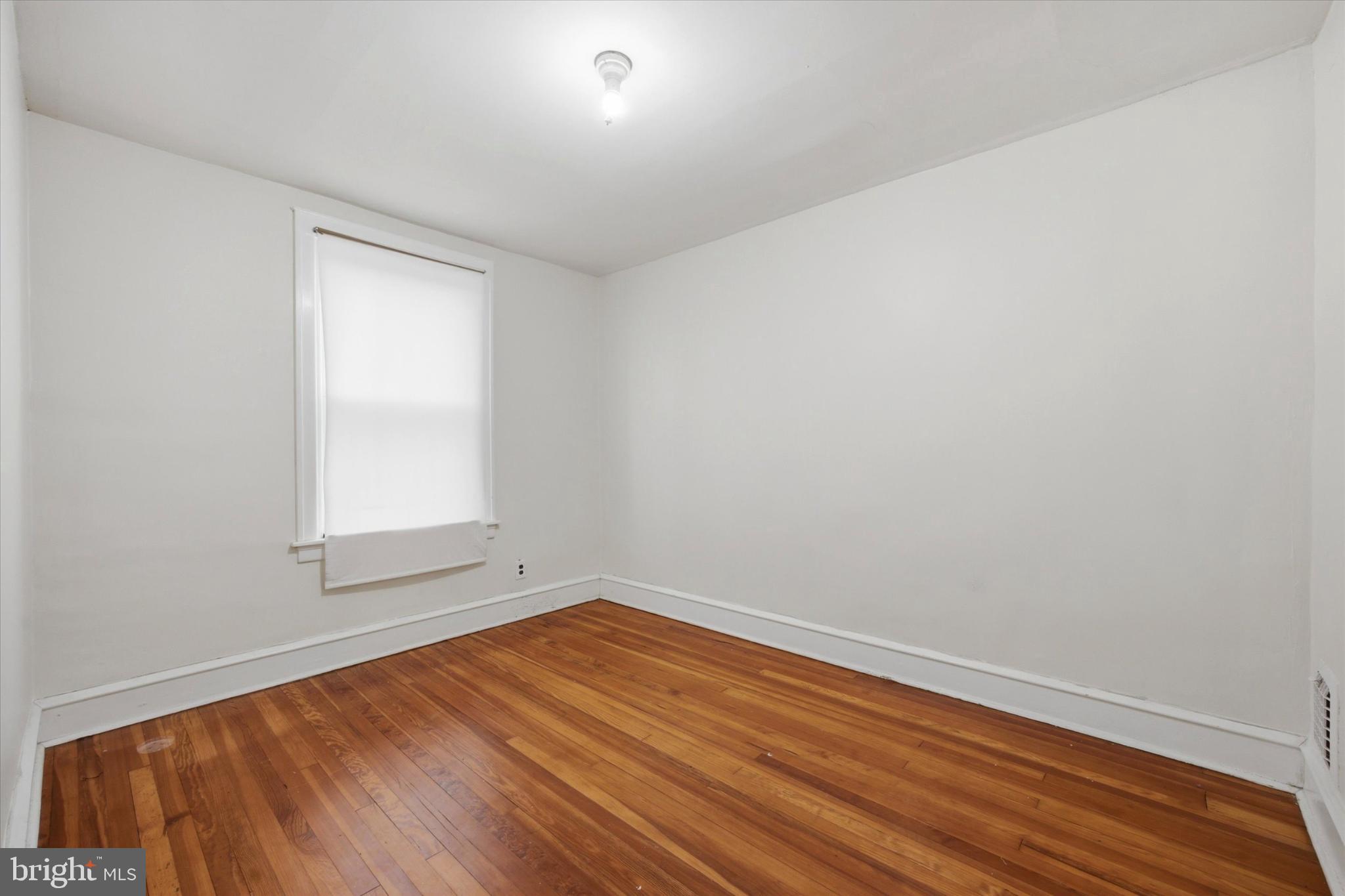 7 Rhodes Avenue Collingdale, PA 19023 - Photo 15 of 27 a view of empty room with wooden floor and fan