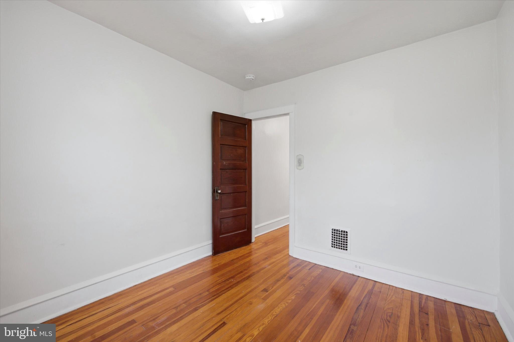 7 Rhodes Avenue Collingdale, PA 19023 - Photo 16 of 27 a view of an empty room with wooden floor
