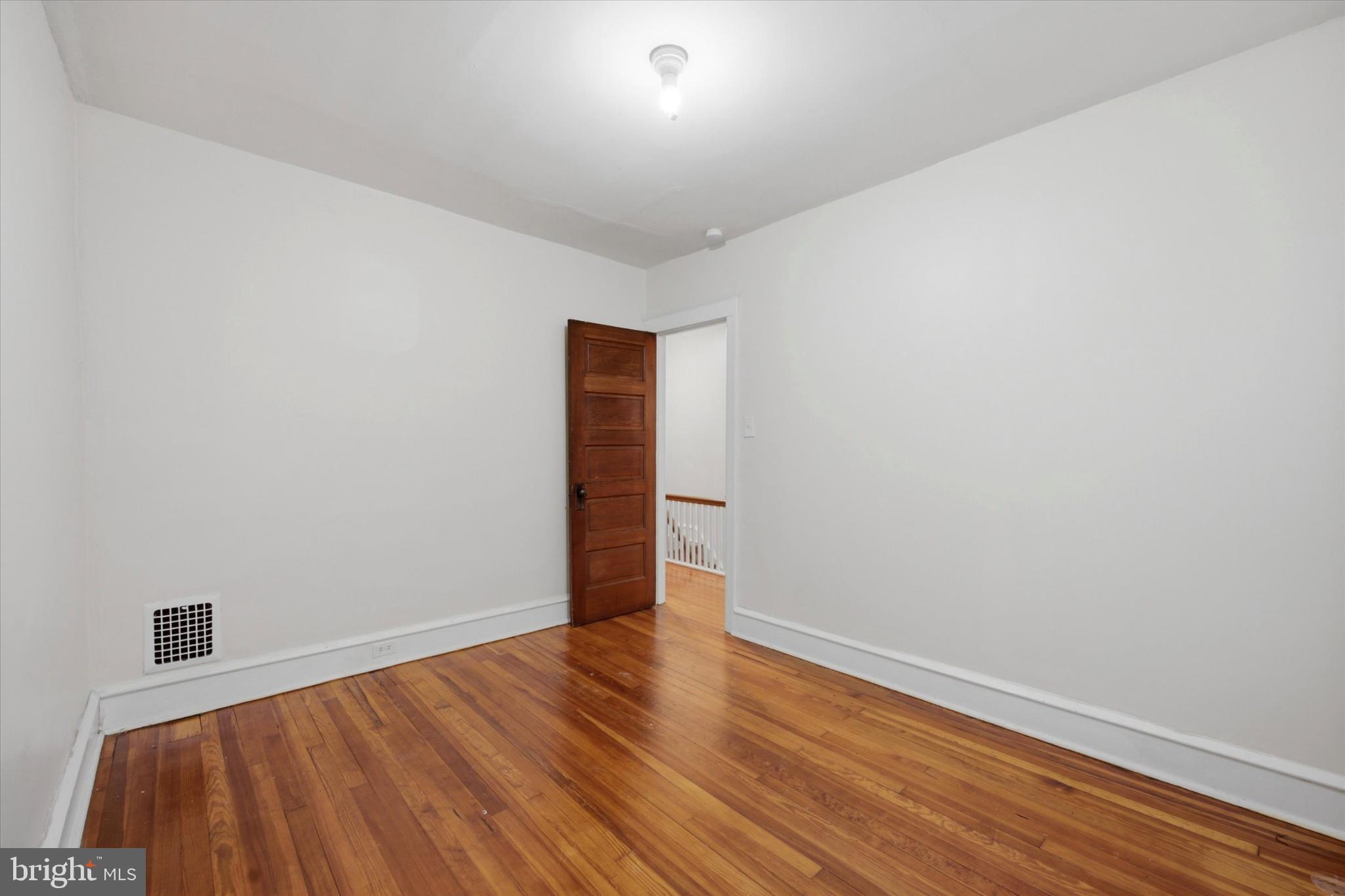 7 Rhodes Avenue Collingdale, PA 19023 - Photo 19 of 27 a view of an empty room with wooden floor
