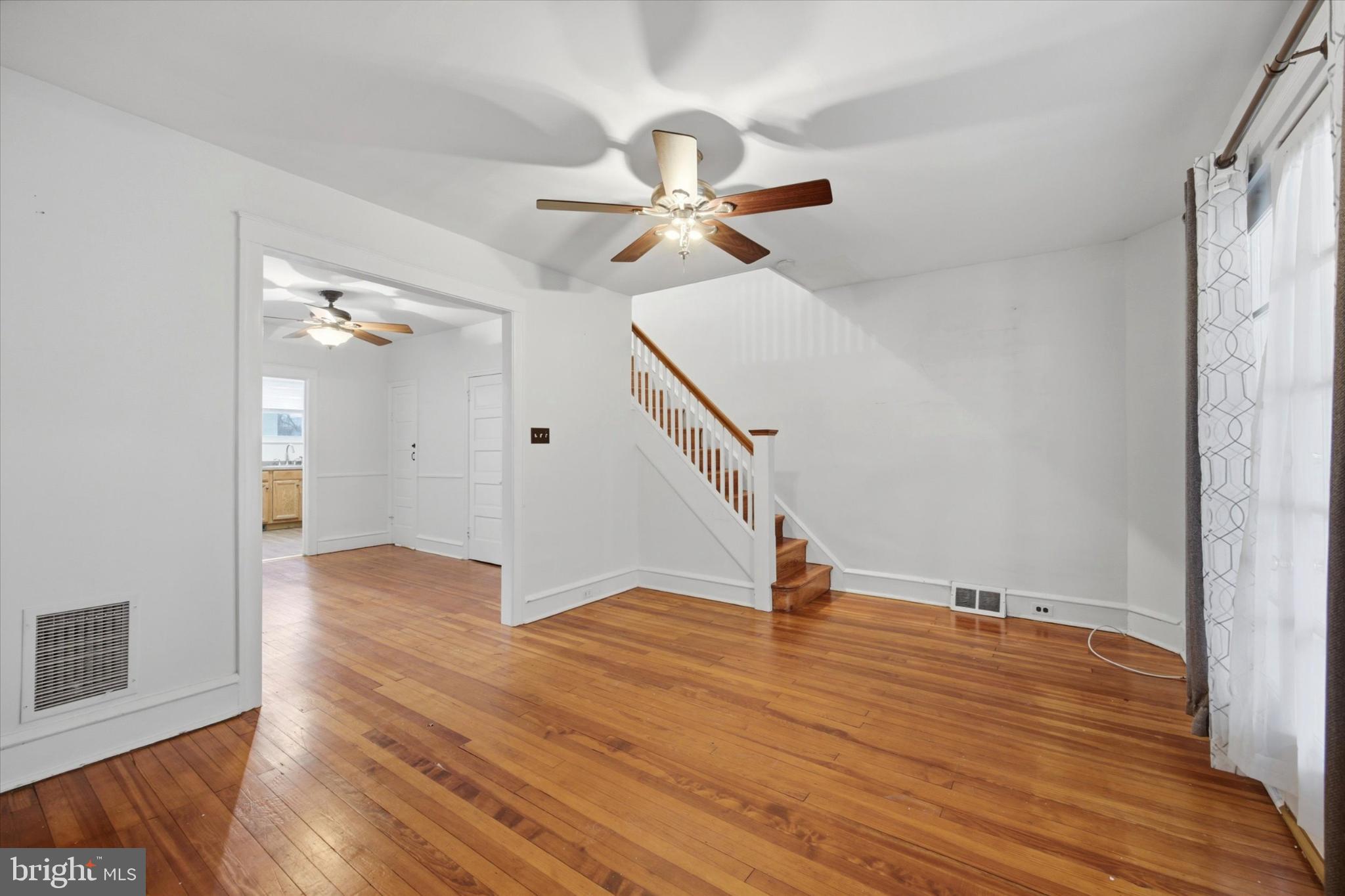 7 Rhodes Avenue Collingdale, PA 19023 - Photo 5 of 27 wooden floor in an empty room with a window