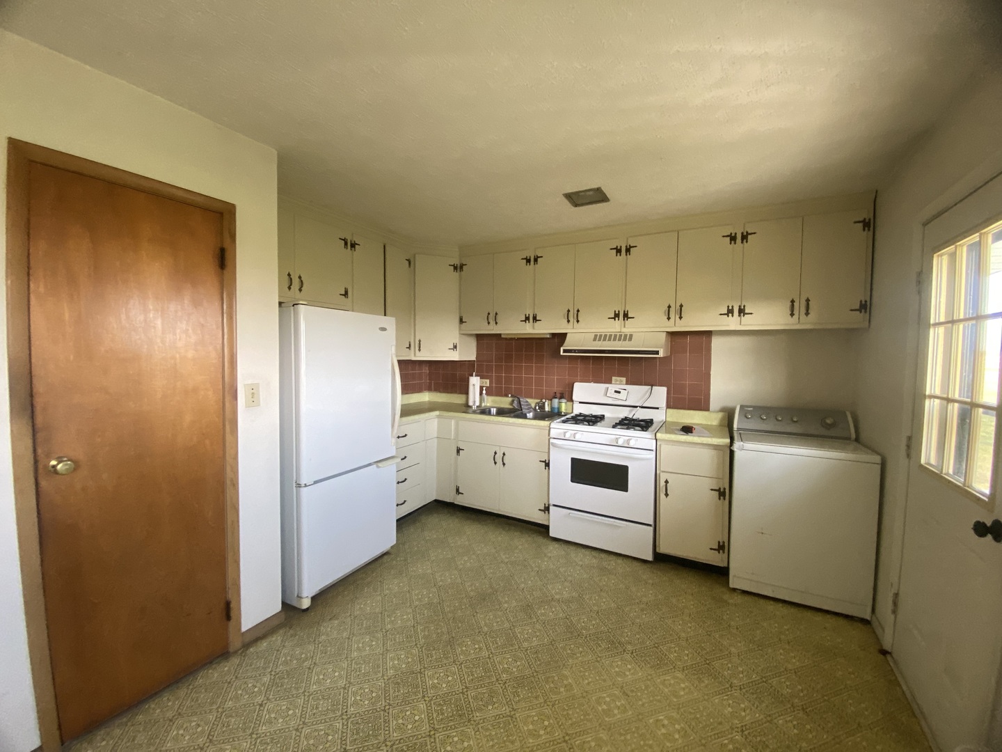 8562 East Park Street Road Du Quoin, IL 62832 - Photo 12 of 17 a kitchen with white cabinets and white appliances