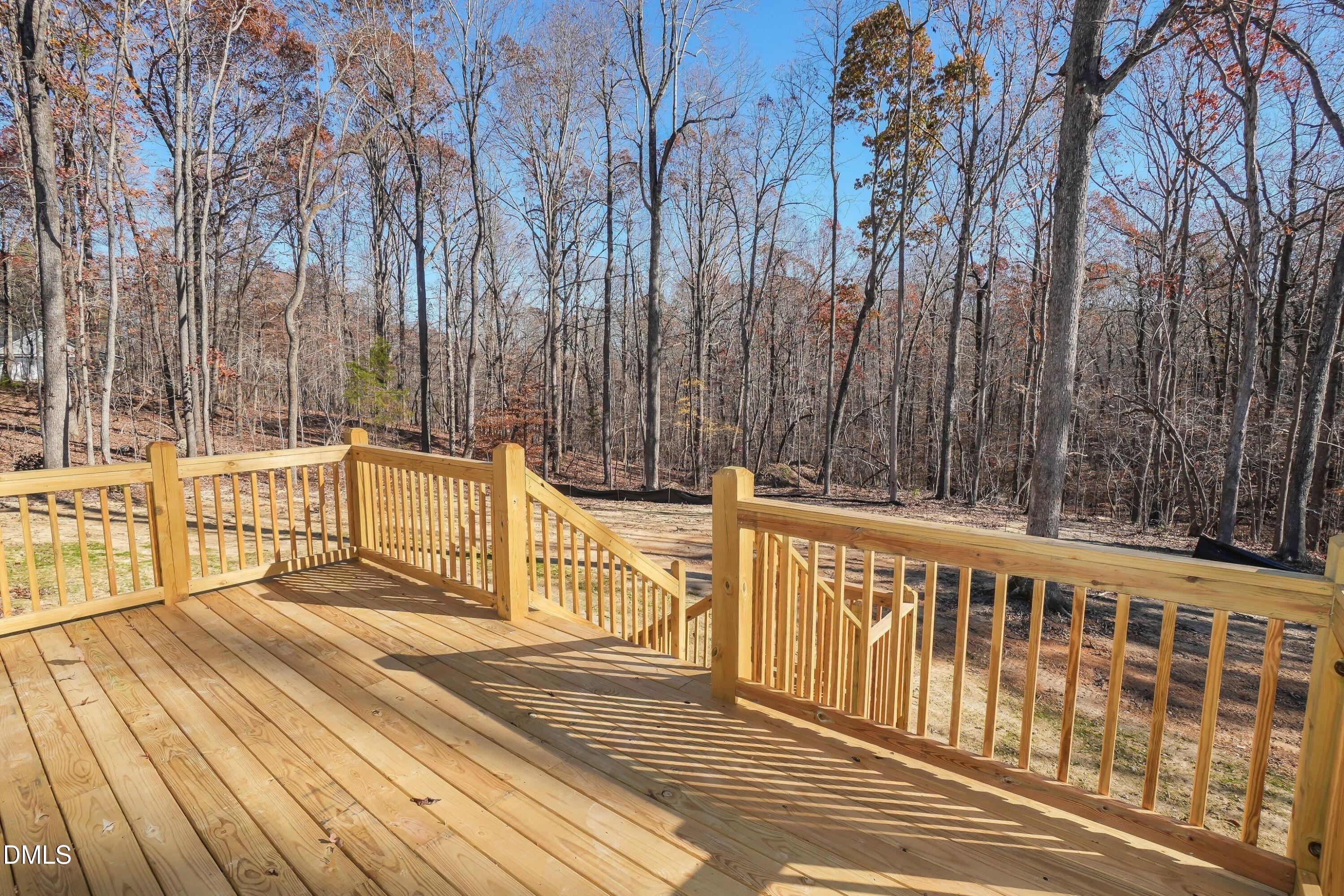 5430 Bass Mountain Road Snow Camp, NC 27349 - Photo 3 of 14 a view of a balcony with wooden floor and fence