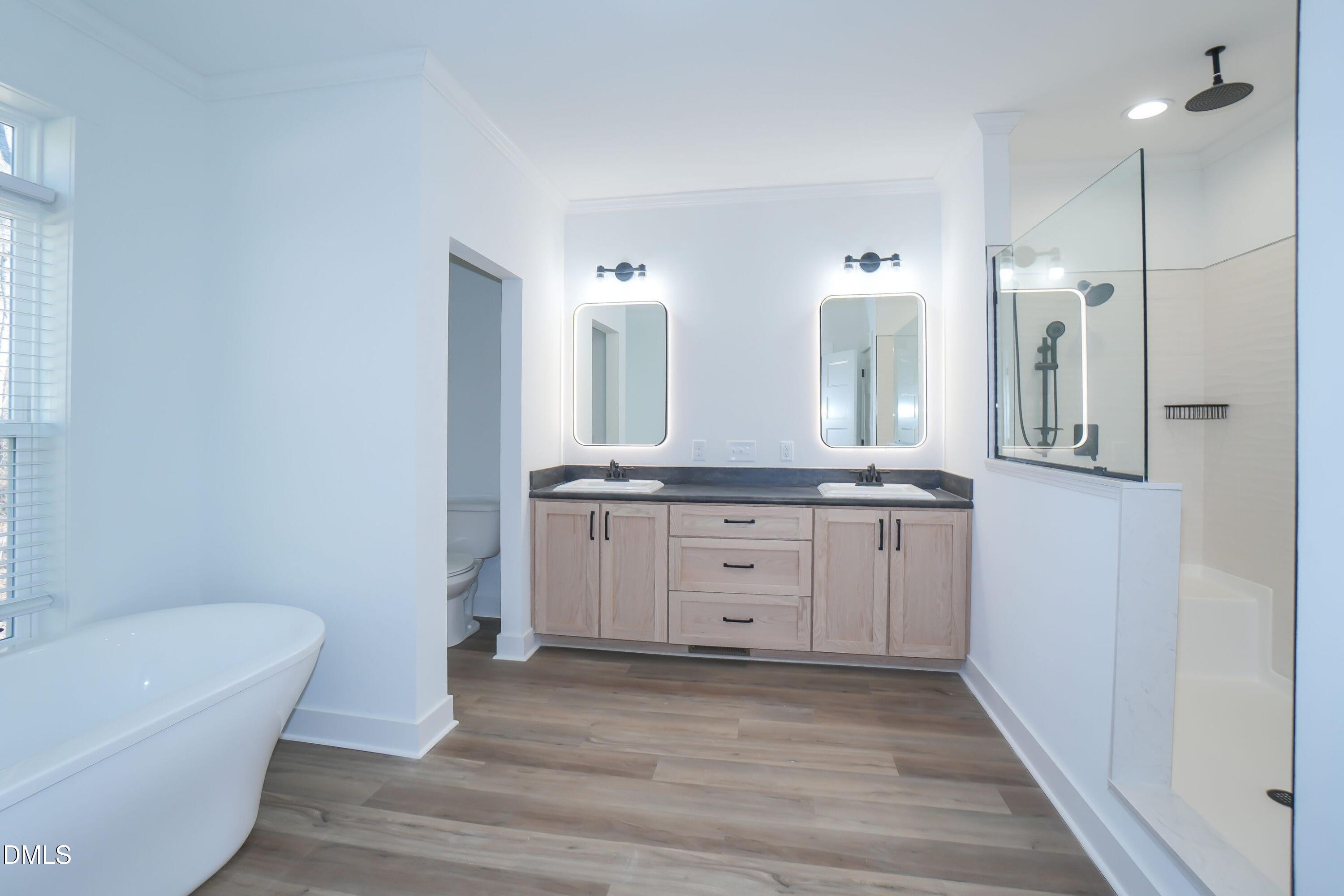 5430 Bass Mountain Road Snow Camp, NC 27349 - Photo 8 of 14 a bathroom with a granite countertop sink mirror and bathtub