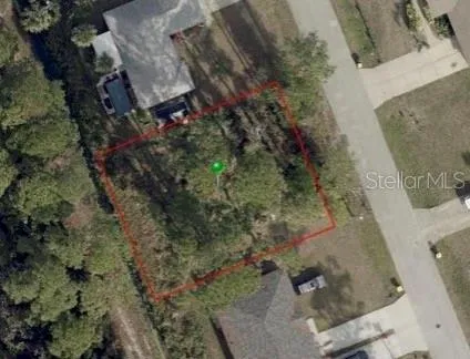 an aerial view of residential house with outdoor space