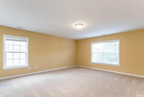 a kitchen with stainless steel appliances granite countertop a stove a refrigerator a sink and dishwasher with wooden cabinets