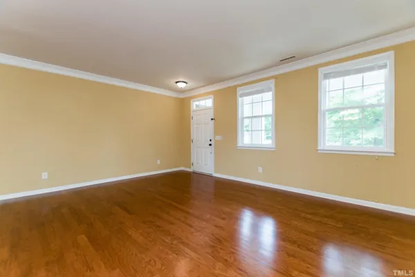 a view of livingroom with window and wooden floor