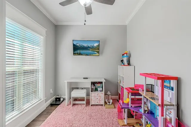 a children room with toys and a book shelf