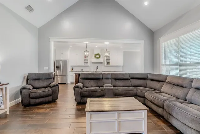 a living room with furniture and a large window