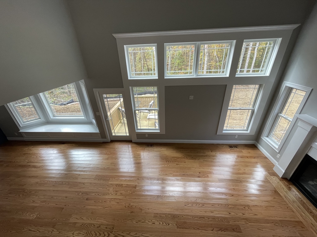 Lot 5 Northside Road Charlton, MA 01507 - Photo 3 of 11 a view of an empty room with window and wooden floor