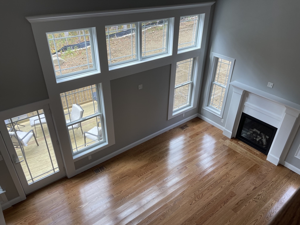 Lot 5 Northside Road Charlton, MA 01507 - Photo 4 of 11 a view of an empty room with wooden floor and a window