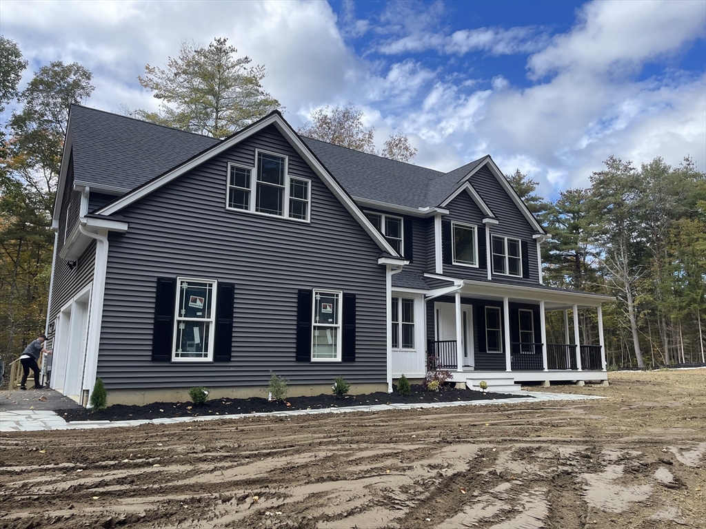 Lot 5 Northside Road Charlton, MA 01507 - Photo 5 of 11 a front view of a house with a garden