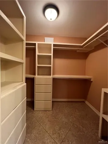 a view of an empty walk in closet
