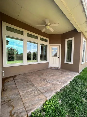 a view of an house with backyard and windows