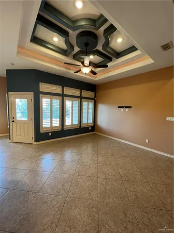 a view of an empty room with windows