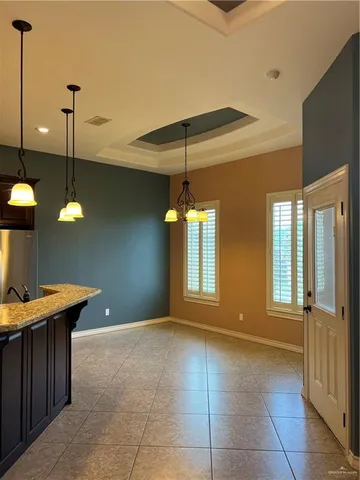 a view of a kitchen with a sink and a window