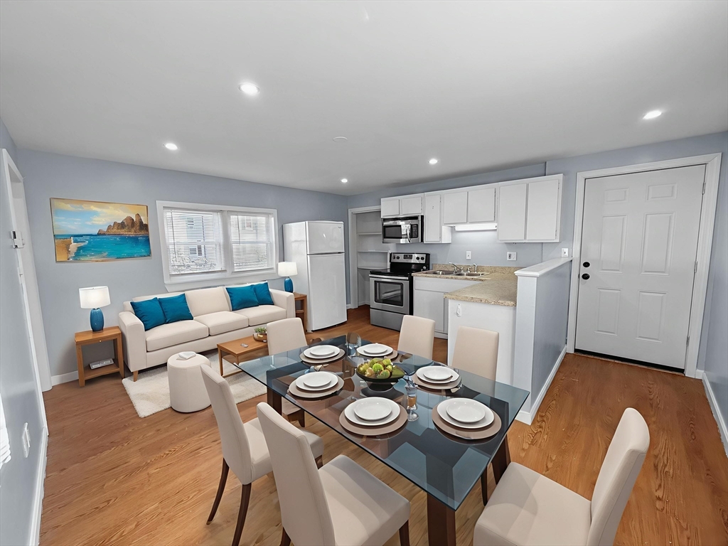 a view of a dining room with furniture and a table