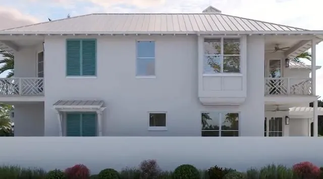 a view of a house with large windows and a yard