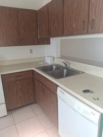 a kitchen with a sink and cabinets