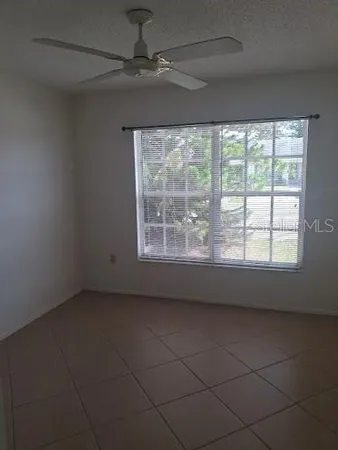 en empty room with windows
