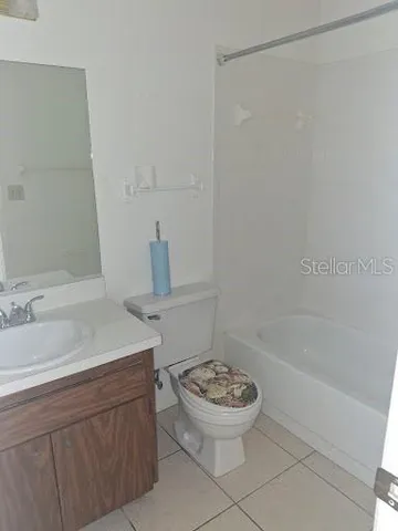 a bathroom with a sink a toilet and a bathtub