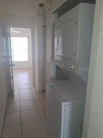 a bathroom with a granite countertop sink a vanity and mirror