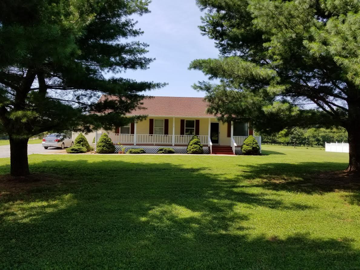 290 Tom Ferrell Road Portland, TN 37148 - Photo 1 of 14 a view of a house with a big yard