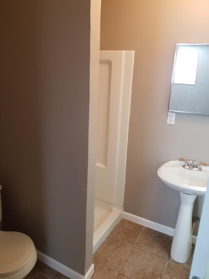 290 Tom Ferrell Road Portland, TN 37148 - Photo 14 of 14 a bathroom with a sink a toilet and mirror