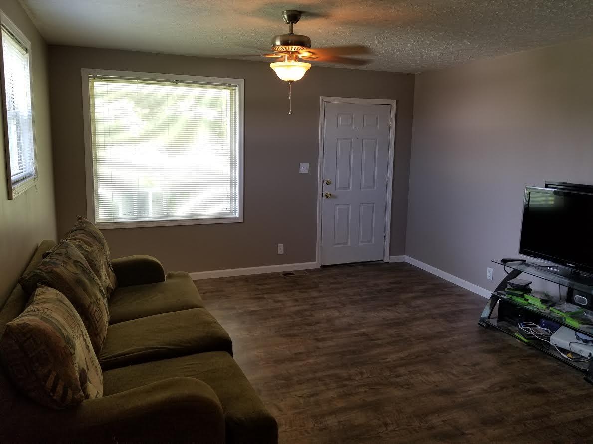 290 Tom Ferrell Road Portland, TN 37148 - Photo 5 of 14 a living room with furniture and a flat screen tv
