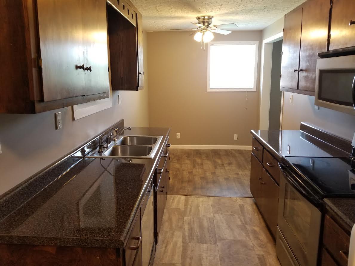 290 Tom Ferrell Road Portland, TN 37148 - Photo 7 of 14 a view of a kitchen counter top space with stainless steel appliances