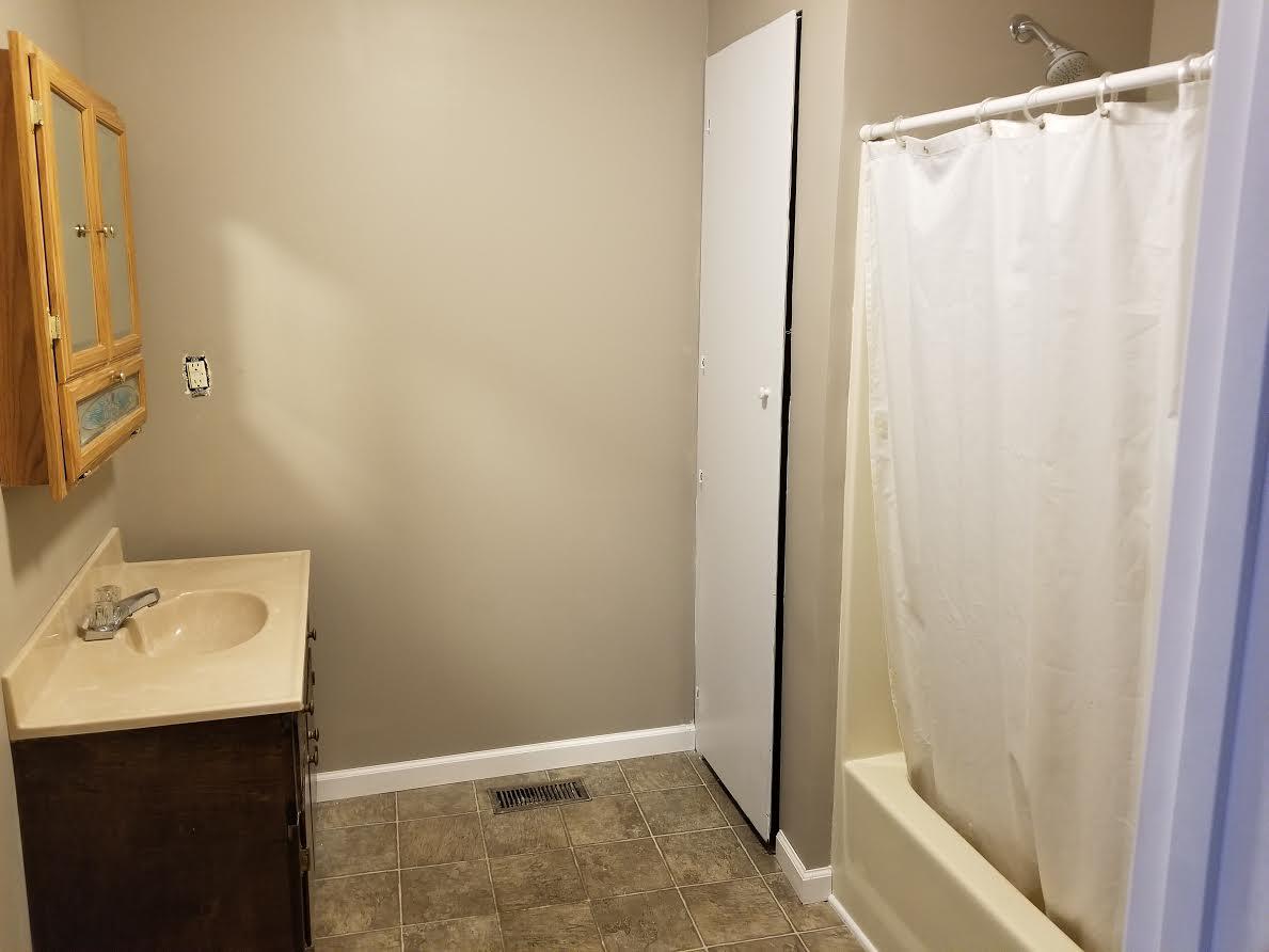 290 Tom Ferrell Road Portland, TN 37148 - Photo 10 of 14 a bathroom with a shower and a sink