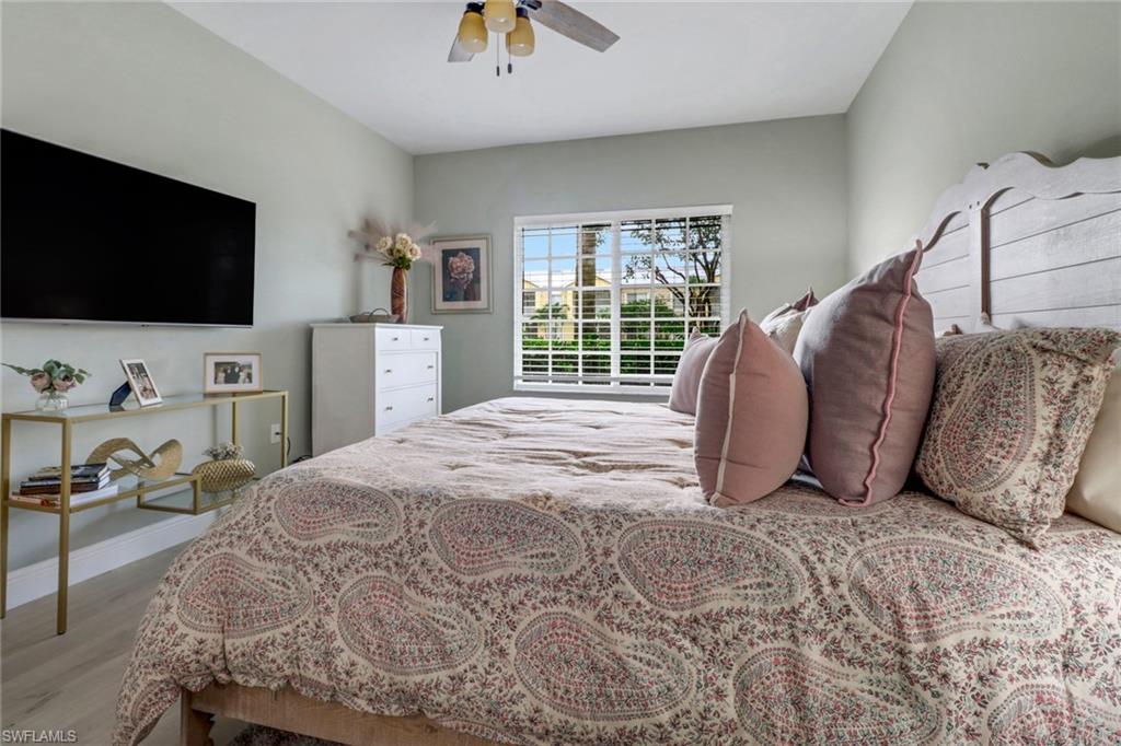 20261 Estero Gardens Circle, Unit 104 Estero, FL 33928 - Photo 15 of 50 Bedroom featuring light hardwood / wood-style flooring and ceiling fan