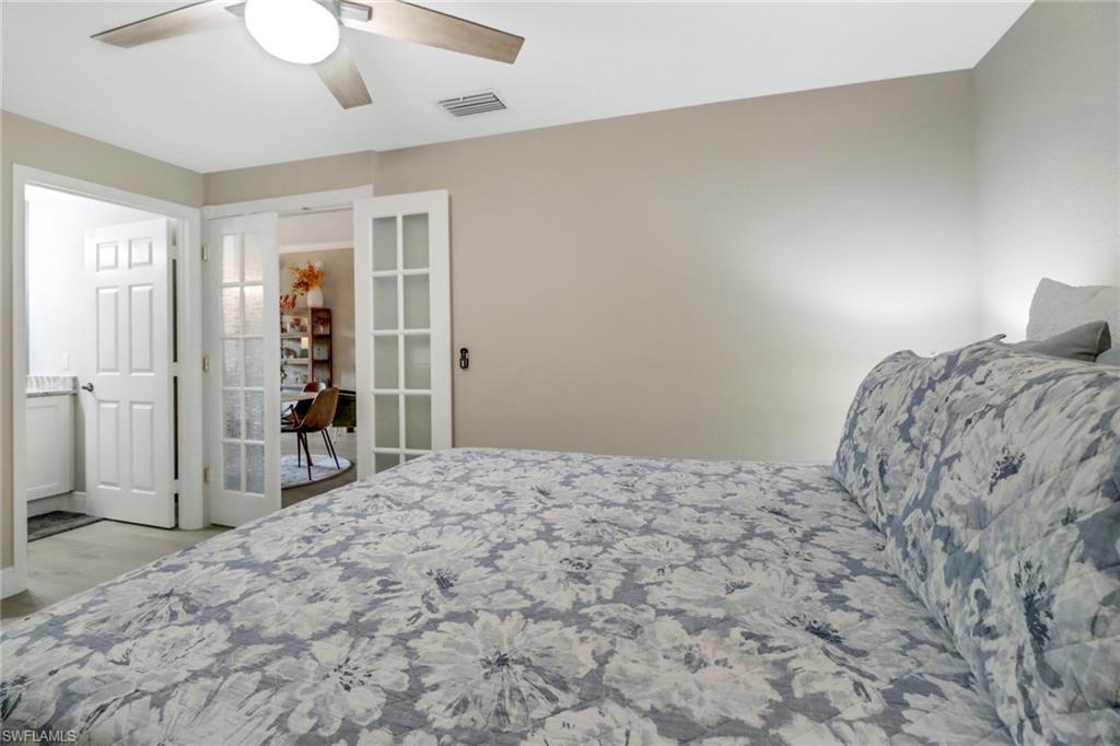20261 Estero Gardens Circle, Unit 104 Estero, FL 33928 - Photo 19 of 50 Bedroom featuring light hardwood / wood-style floors and ceiling fan