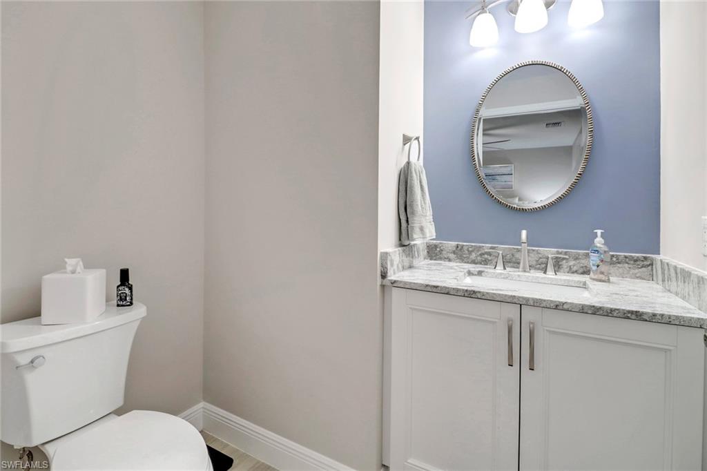20261 Estero Gardens Circle, Unit 104 Estero, FL 33928 - Photo 20 of 50 Bathroom featuring vanity and toilet