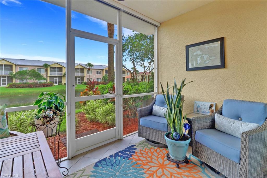 20261 Estero Gardens Circle, Unit 104 Estero, FL 33928 - Photo 23 of 50 Sunroom / solarium with a water view