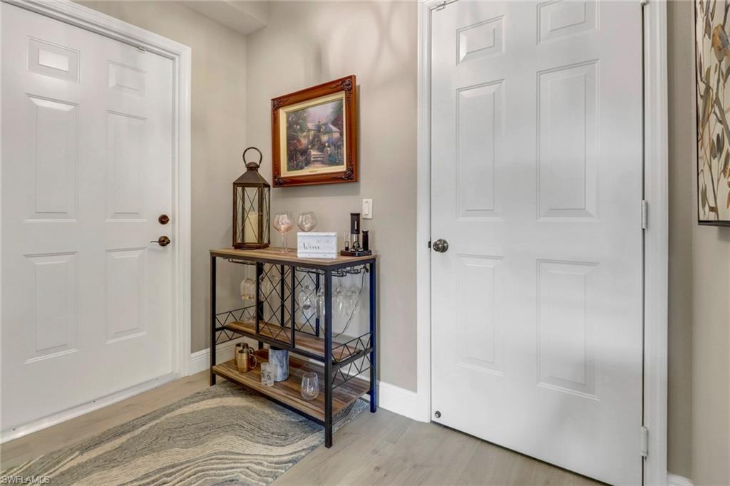 20261 Estero Gardens Circle, Unit 104 Estero, FL 33928 - Photo 4 of 50 Foyer featuring light hardwood / wood-style floors