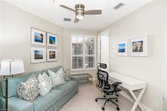 a living room with furniture and windows