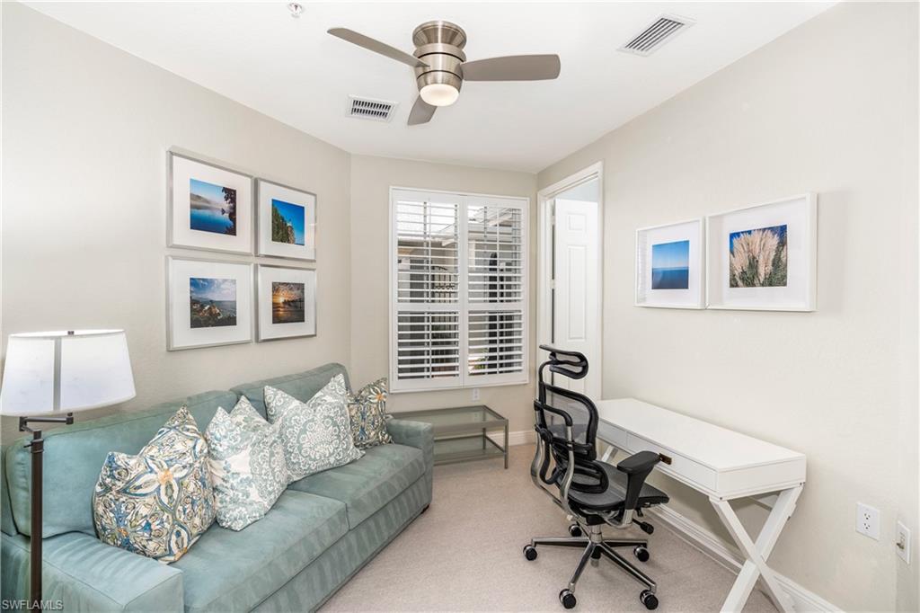 9259 Museo Circle, Unit 7102 Naples, FL 34114 - Photo 17 of 41 a living room with furniture and windows